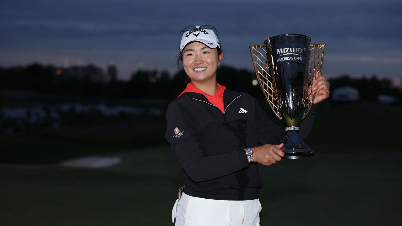 JERSEY CITY, NEW JERSEY - JUNE 04: Rose Zhang of the United States poses with the trophy after winning the Mizuho Americas Open in a playoff over Jennifer Kupcho of the United States (not pictured) during the final round at Liberty National Golf Club on June 4, 2023 in Jersey City, New Jersey.