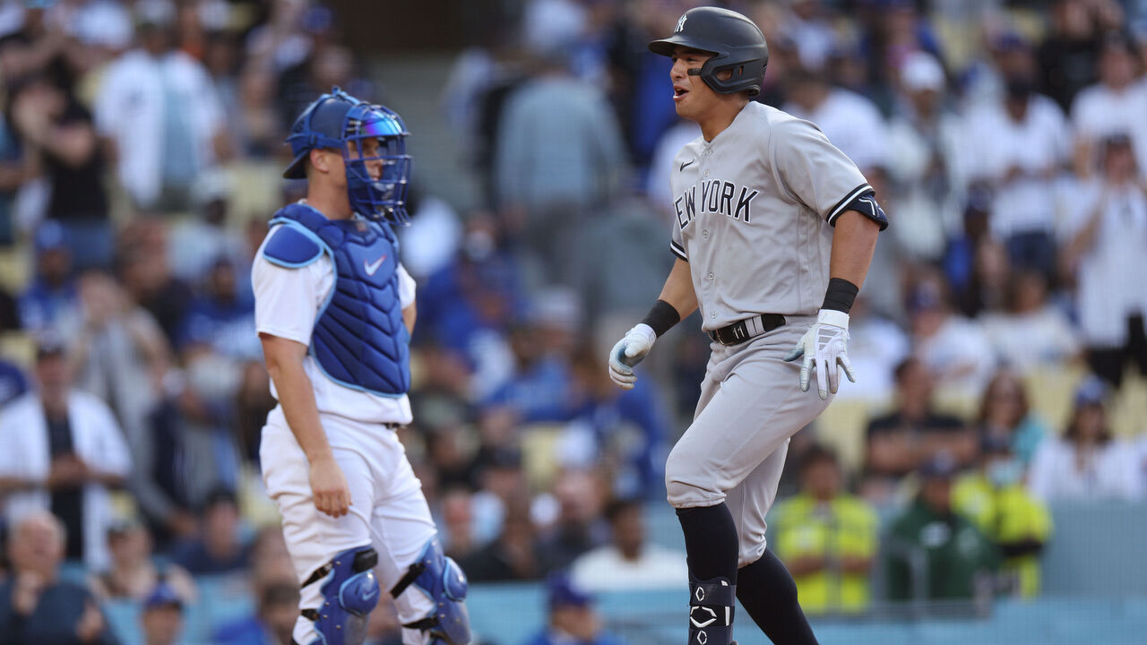 LOS ANGELES, CALIFORNIA - JUNE 04: Anthony Volpe #11 of the New York Yankees celebrates his two run homerun past Will Smith #16 of the Los Angeles Dodgers, to take a 4-1 lead, during the ninth inning at Dodger Stadium on June 04, 2023 in Los Angeles, California.