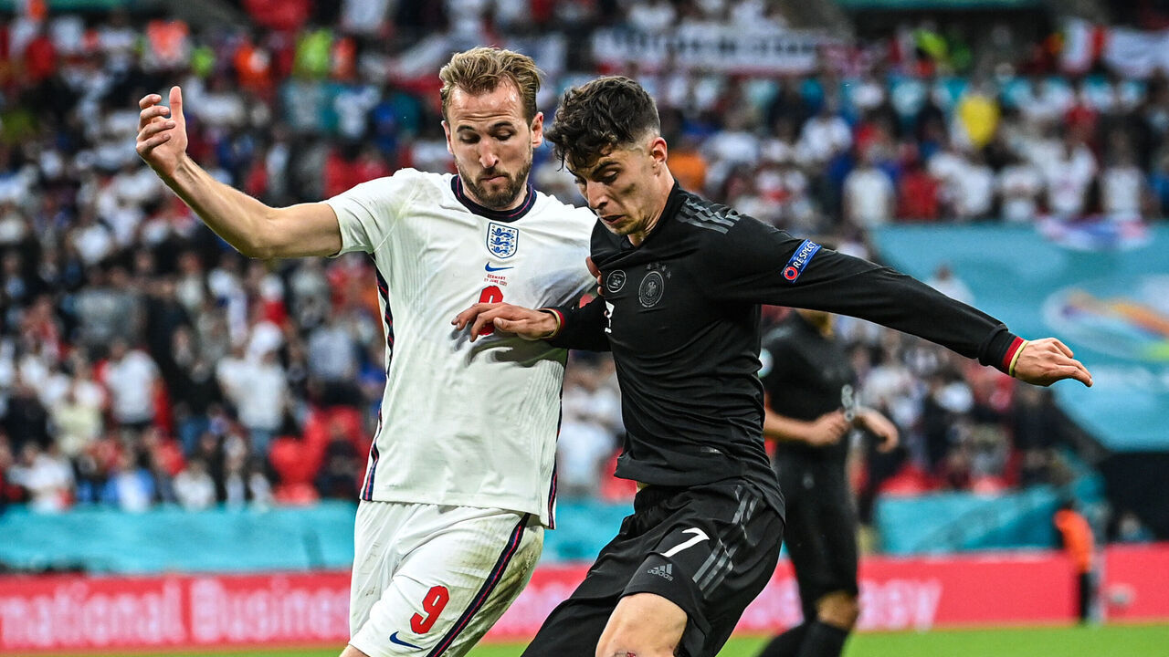 LONDON, ENGLAND - JUNE 29: Harry Kane (L) of England challenges for the ball with Kai Havertz (R) of Germany during the UEFA Euro 2020 Championship Round of 16 match between England and Germany at Wembley Stadium on June 29, 2021 in London, England.