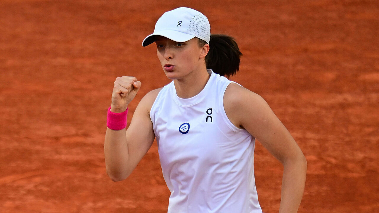 Poland's Iga Swiatek reacts as she plays against Ukraine's Lesia Tsurenko during their women's singles match on day nine of the Roland-Garros Open tennis tournament at the Court Suzanne-Lenglen in Paris on June 5, 2023.