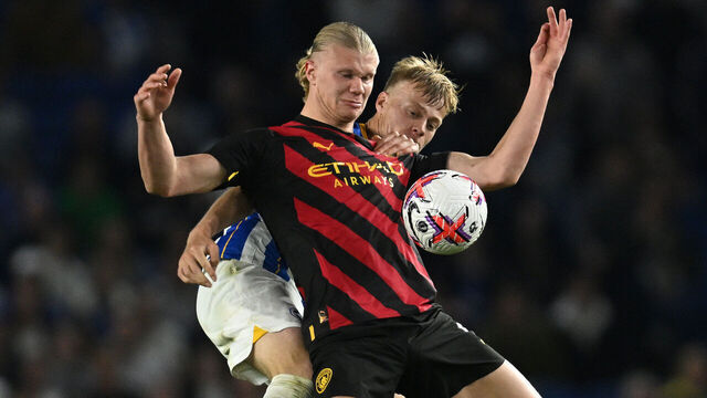 BRIGHTON, ENGLAND - MAY 24: Erling Haaland of Manchester City holds off Jan Paul van Hecke of Brighton & Hove Albion during the Premier League match between Brighton & Hove Albion and Manchester City at American Express Community Stadium on May 24, 2023 in Brighton, England.