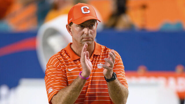 MIAMI GARDENS, FL - DECEMBER 30: Clemson head coach Dabo Swinney claps his hands as he watches the players on the field before the Capital One Orange Bowl college football game between the Tennessee Volunteers and the Clemson Tigers on December 30, 2022 at the Hard Rock Stadium in Miami Gardens, FL.