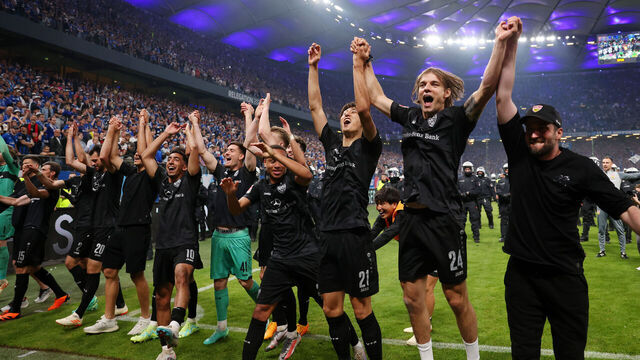 HAMBURG, GERMANY - JUNE 05: VfB Stuttgart players celebrate towards their fans after the team staying up in the Bundesliga and victory in the Bundesliga playoffs second leg match between Hamburger SV and VfB Stuttgart at Volksparkstadion on June 05, 2023 in Hamburg, Germany.