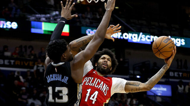 NEW ORLEANS, LOUISIANA - NOVEMBER 15: Brandon Ingram #14 of the New Orleans Pelicans shoots over Jaren Jackson Jr. #13 of the Memphis Grizzlies during the fourth quarter of an NBA game at Smoothie King Center on November 15, 2022 in New Orleans, Louisiana. New Orleans Pelicans won the game 113 - 102.