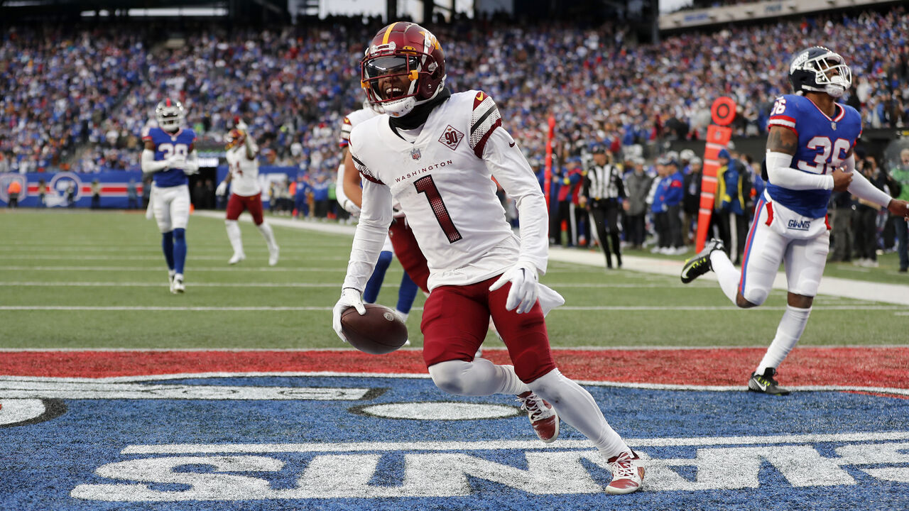 EAST RUTHERFORD, NEW JERSEY - DECEMBER 04: (NEW YORK DAILIES OUT) Jahan Dotson #1 of the Washington Commanders touchdown against the New York Giants at MetLife Stadium on December 04, 2022 in East Rutherford, New Jersey. The game ended in a 20-20 tie.