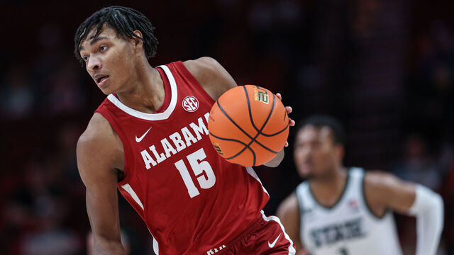 PORTLAND, OR - NOVEMBER 24: Noah Clowney #15 of the Alabama Crimson Tide brings the ball up court against the Michigan State Spartans at Moda Center on November 24, 2022 in Portland, Oregon.