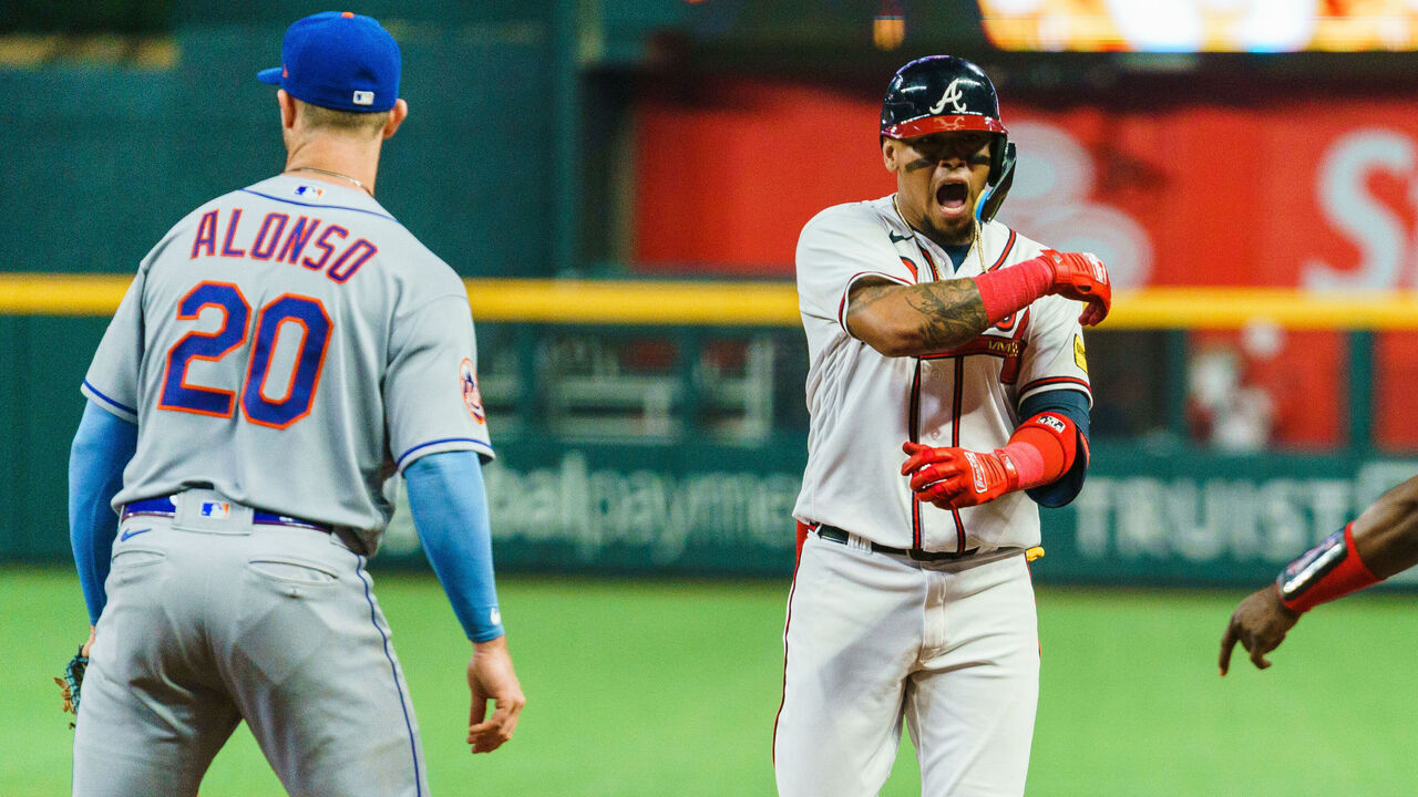 ATLANTA, GA - JUNE 6: Orlando Arcia #11 of the Atlanta Braves celebrates during the sixth inning during the game against the New York Mets at Truist Park on June 6, 2023 in Atlanta, Georgia.