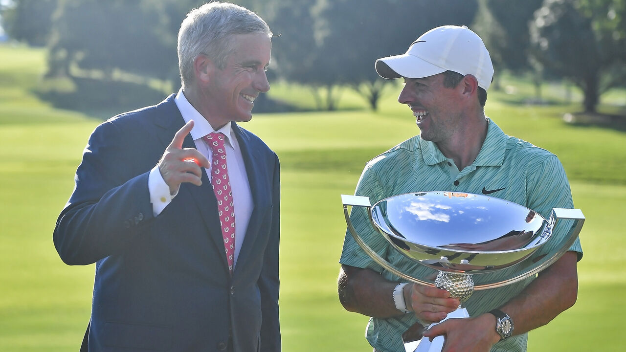 ATLANTA, GA - AUGUST 28: PGA Commissioner Jay Monahan (left) laughs with Rory McIlroy (right) after McIlroy won the PGA Tour Championship on Sunday, August 28, 2022 at East Lake Golf Club in Atlanta, GA.