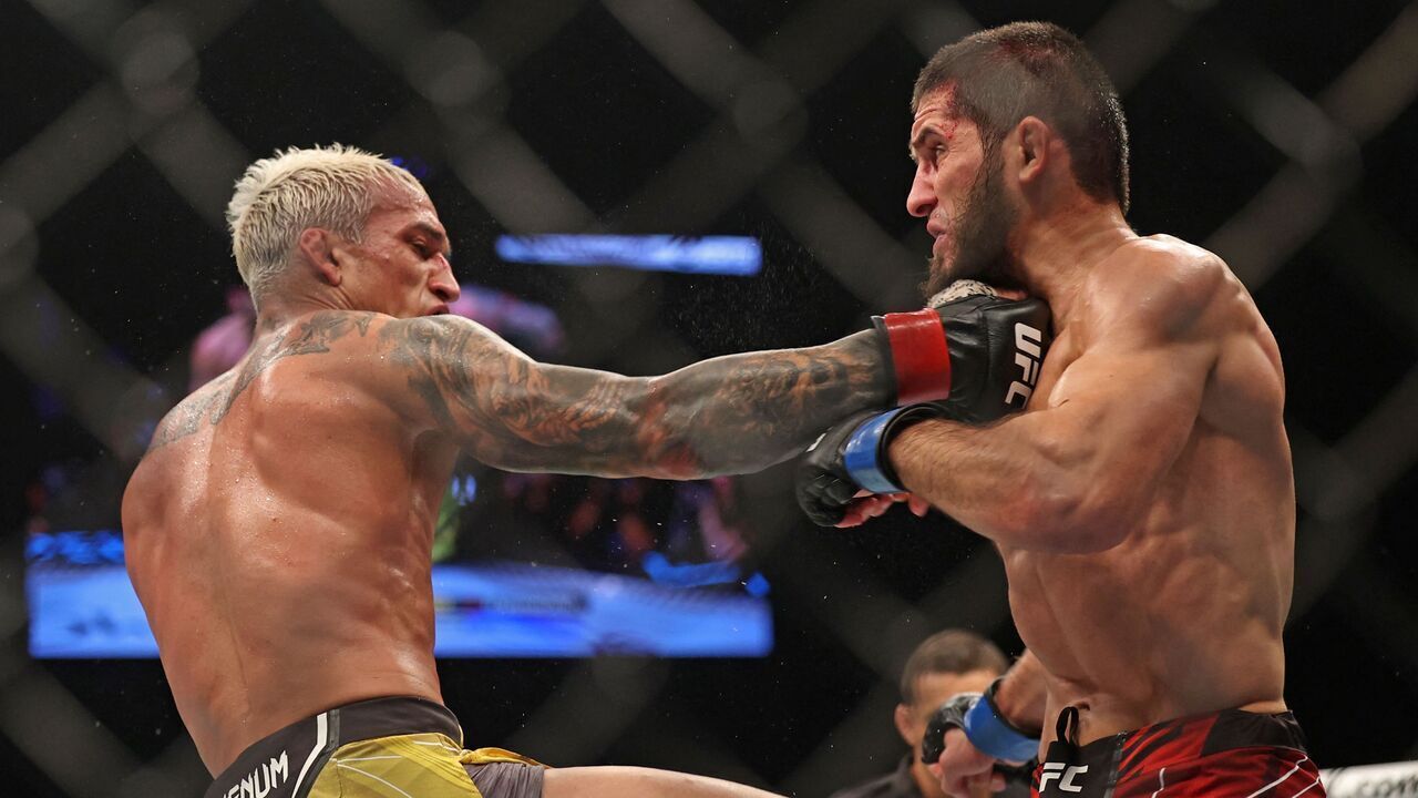 Islam Makhachev (R) competes against Charles Oliveira in the lightweight championship at the Ultimate Fighting Championship (UFC) event at the Etihad Arena in Abu Dhabi on October 22, 2022.
