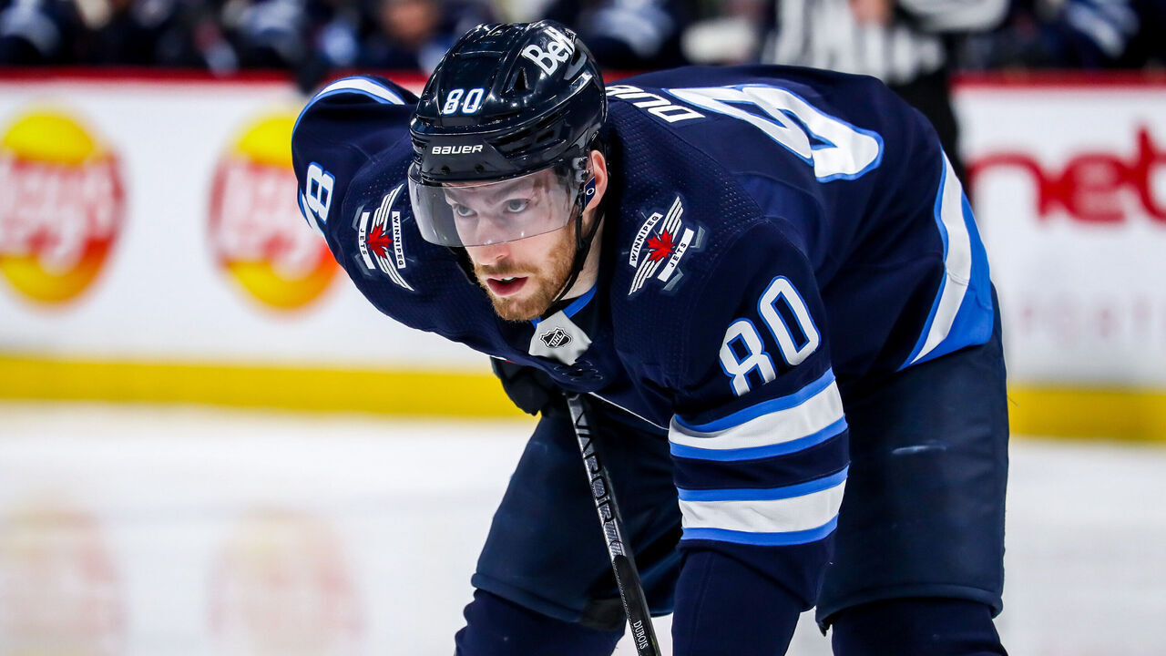 WINNIPEG, CANADA - APRIL 8: Pierre-Luc Dubois #80 of the Winnipeg Jets gets set during a second period face-off against the Nashville Predators at the Canada Life Centre on April 8, 2023 in Winnipeg, Manitoba, Canada.