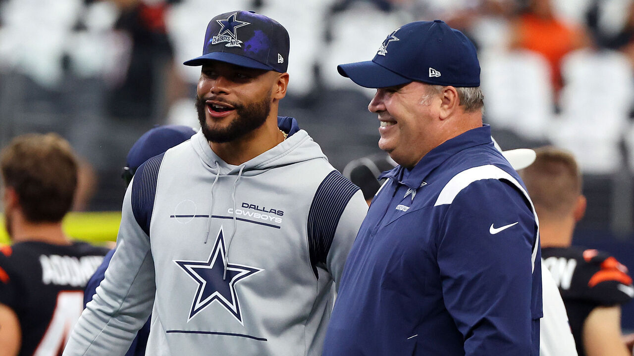 ARLINGTON, TEXAS - SEPTEMBER 18: Dak Prescott of the Dallas Cowboys and head coach Mike McCarthy visit during warmups before the game against the Cincinnati Bengals at AT&T Stadium on September 18, 2022 in Arlington, Texas.