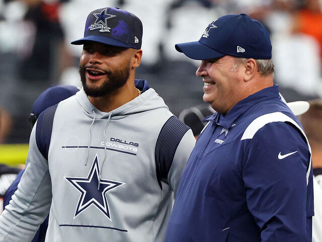 ARLINGTON, TEXAS - SEPTEMBER 18: Dak Prescott of the Dallas Cowboys and head coach Mike McCarthy visit during warmups before the game against the Cincinnati Bengals at AT&T Stadium on September 18, 2022 in Arlington, Texas.