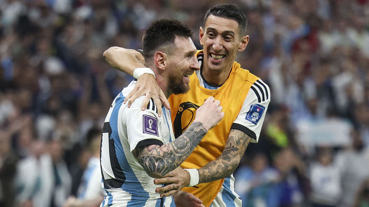 LUSAIL CITY, QATAR - DECEMBER 18: Lionel Messi of Argentina celebrates with Angel Di Maria after scoring their team's third goal p during the FIFA World Cup Qatar 2022 Final match between Argentina and France at Lusail Stadium on December 18, 2022 in Lusail City, Qatar.