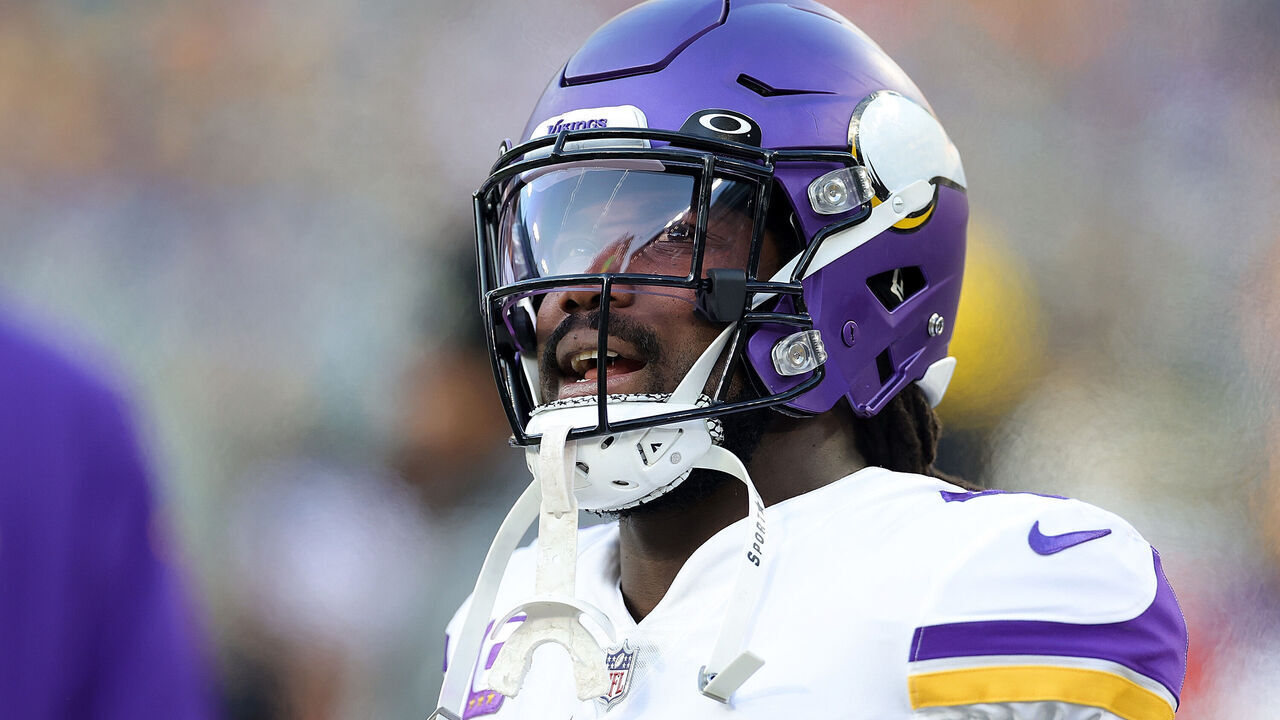 GREEN BAY, WISCONSIN - JANUARY 01: Dalvin Cook #4 of the Minnesota Vikings watches action prior to a game against the Green Bay Packers at Lambeau Field on January 01, 2023 in Green Bay, Wisconsin. The Packers defeated the Vikings 41-17.