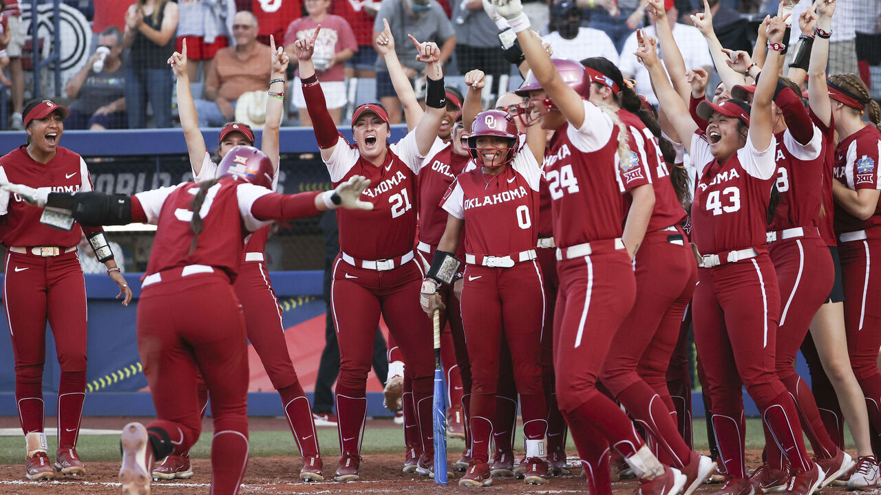 OKLAHOMA CITY, OK - JUNE 08: Players of the Oklahoma Sooners react to Grace Lyons #3 of the Oklahoma Sooners getting a home run against the Florida State Seminoles during the Division I Women's Softball Championship held at USA Softball Hall of Fame Stadium on June 8, 2023 in Oklahoma City, Oklahoma.