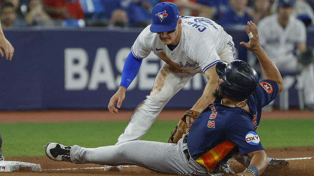 TORONTO, ON - JUNE 8: Toronto Blue Jays third baseman Matt Chapman (26) puts the tag on Houston Astros first baseman Jose Abreu (79) trying to get to 3rd base, but a bit late. Toronto Blue Jays Vs Houston Astros during MLB regular season matchup at Roger's Centre in Toronto. Jays won 3-2.Toronto Star (Rick Madonik/Toronto Star via Getty Images)