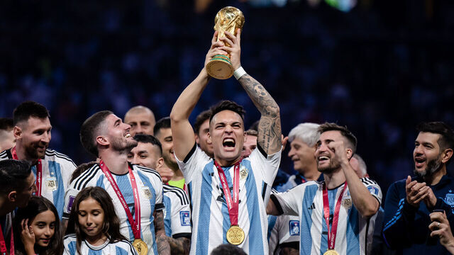 LUSAIL CITY, QATAR - DECEMBER 18: Lautaro Martinez of Argentina lifts the World Cup trophy after the FIFA World Cup Qatar 2022 Final match between Argentina and France at Lusail Stadium on December 18, 2022 in Lusail City, Qatar.