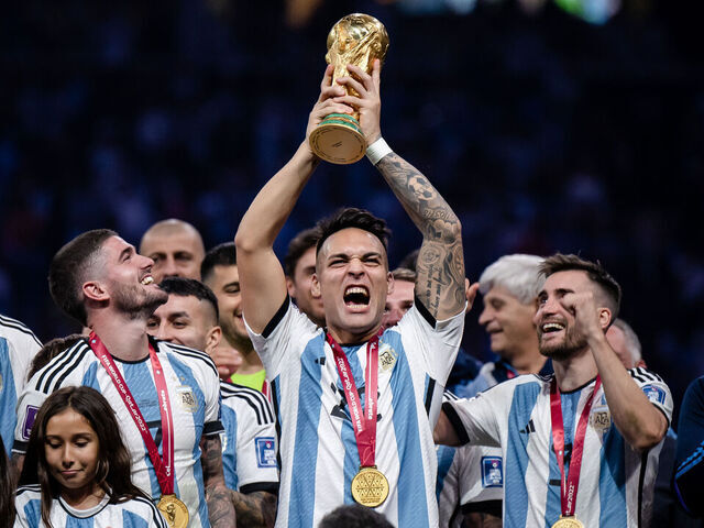 LUSAIL CITY, QATAR - DECEMBER 18: Lautaro Martinez of Argentina lifts the World Cup trophy after the FIFA World Cup Qatar 2022 Final match between Argentina and France at Lusail Stadium on December 18, 2022 in Lusail City, Qatar.