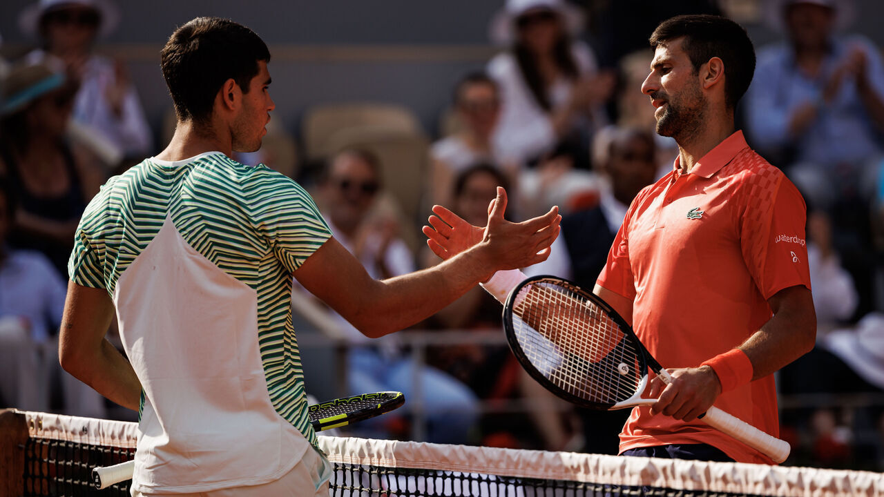PARIS, FRANCE - JUNE 09: Novak Djokovic of Serbia shakes hands with Carlos Alcaraz of Spain after defeating him in the semi-finals of the men's singles at Roland Garros on June 09, 2023 in Paris, France.