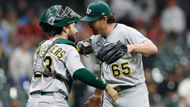 MILWAUKEE, WISCONSIN - JUNE 09: Trevor May #65 and Shea Langeliers #23 of the Oakland Athletics congratulate each other after a 5-2 win against the Milwaukee Brewers at American Family Field on June 09, 2023 in Milwaukee, Wisconsin.