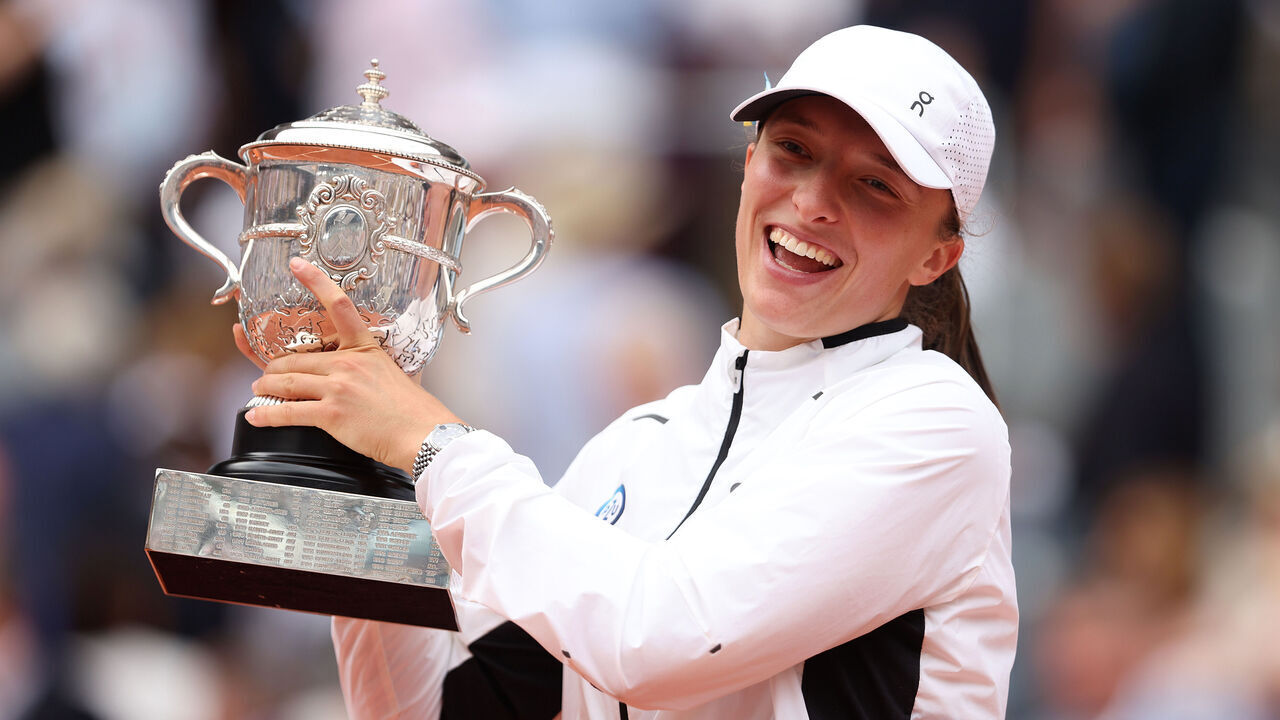 PARIS, FRANCE - JUNE 10: Iga Swiatek of Poland celebrates with her winners trophy after victory against Karolina Muchova of Czech Republic in the Women's Singles Final match on Day Fourteen of the 2023 French Open at Roland Garros on June 10, 2023 in Paris, France.