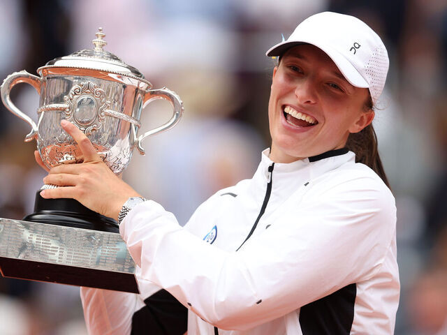 PARIS, FRANCE - JUNE 10: Iga Swiatek of Poland celebrates with her winners trophy after victory against Karolina Muchova of Czech Republic in the Women's Singles Final match on Day Fourteen of the 2023 French Open at Roland Garros on June 10, 2023 in Paris, France.