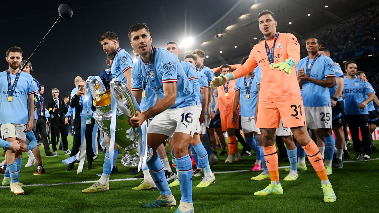 ISTANBUL, TURKEY - JUNE 10: Rodri of Manchester City celebrates with the UEFA Champions League trophy after the team's victory during the UEFA Champions League 2022/23 final match between FC Internazionale and Manchester City FC at Atatuerk Olympic Stadium on June 10, 2023 in Istanbul, Turkey.