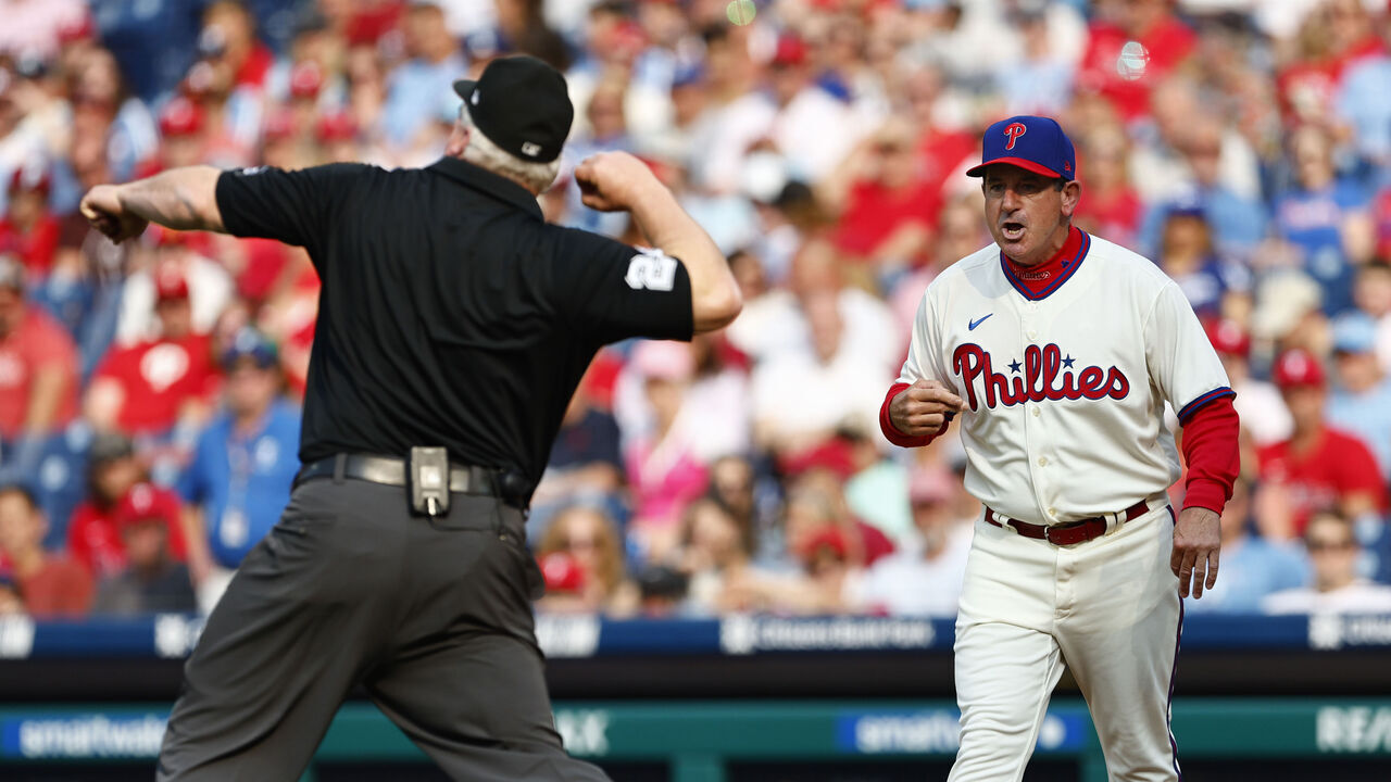 PHILADELPHIA, PENNSYLVANIA - JUNE 10: Manager Rob Thomson #59 of the Philadelphia Phillies is thrown out of the game by third base umpire Bill Miller during the sixth inning against the Los Angeles Dodgers, after arguing about a warning given to Phillies pitcher Aaron Nola #27 for throwing too many balls away at Citizens Bank Park on June 10, 2023 in Philadelphia, Pennsylvania.