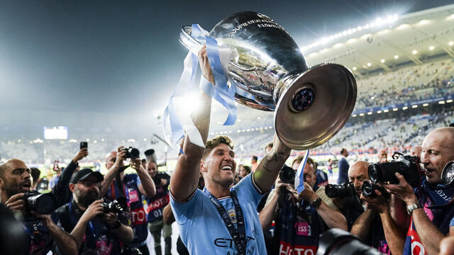 ISTANBUL, TURKEY - JUNE 10: John Stones of Manchester City celebrates with the UEFA Champions league trophy after winning Inter Milano during the UEFA Champions League 2022/23 final match between FC Internazionale and Manchester City FC at Atatuerk Olympic Stadium on June 10, 2023 in Istanbul, Turkey.