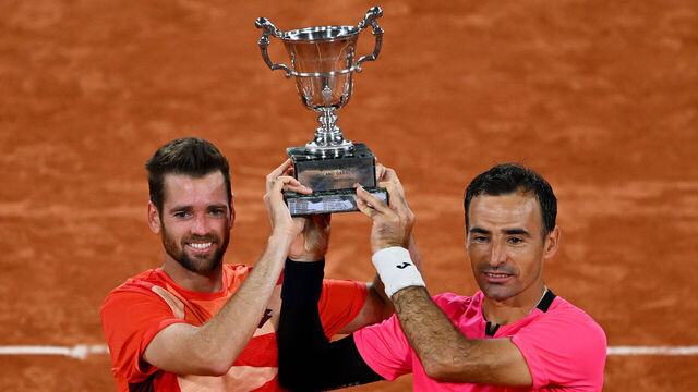 PARIS, FRANCE - JUNE 10: Ivan Dodig of Croatia and partner Austin Krajicek of United States pose with the winners trophy after victory against Sander Gille of Belgium and Joran Vliegen of Belgium during the Men's Doubles Final match on Day Fourteen of the 2023 French Open at Roland Garros on June 10, 2023 in Paris, France.