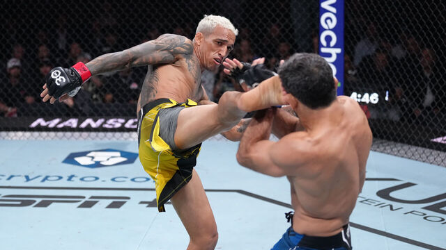 VANCOUVER, BRITISH COLUMBIA - JUNE 10: (L-R) Charles Oliveira of Brazil kicks Beneil Dariush of Iran in their lightweight fight during the UFC 289 event at Rogers Arena on June 10, 2023 in Vancouver, Canada.