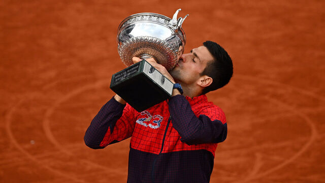 PARIS, FRANCE - JUNE 11: Novak Djokovic of Serbia kisses the winners trophy after victory against Casper Ruud of Norway in the Men's Singles Final match on Day Fifteen of the 2023 French Open at Roland Garros on June 11, 2023 in Paris, France.