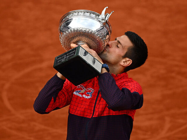 PARIS, FRANCE - JUNE 11: Novak Djokovic of Serbia kisses the winners trophy after victory against Casper Ruud of Norway in the Men's Singles Final match on Day Fifteen of the 2023 French Open at Roland Garros on June 11, 2023 in Paris, France.