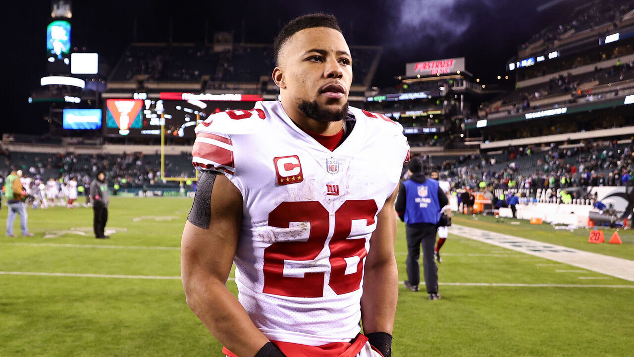 PHILADELPHIA, PENNSYLVANIA - JANUARY 21: Saquon Barkley #26 of the New York Giants walks off the field after losing to the Philadelphia Eagles 38-7 in the NFC Divisional Playoff game at Lincoln Financial Field on January 21, 2023 in Philadelphia, Pennsylvania.