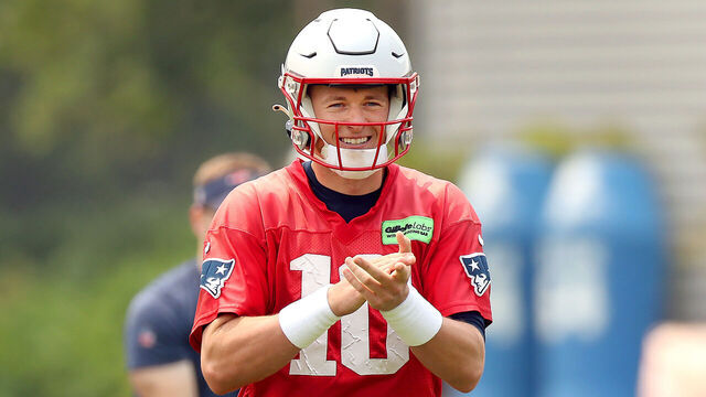 Foxborough, MA - June 6: New England Patriots QB Mac Jones smiles after completing a pass.