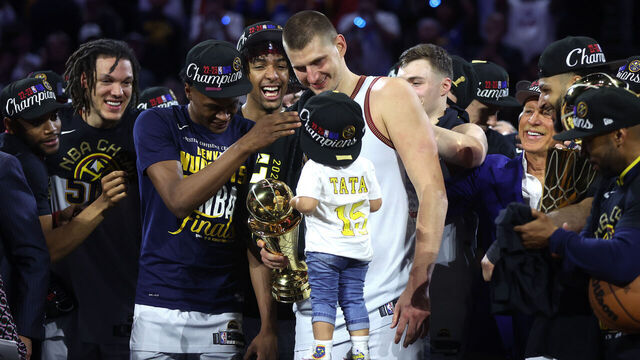 DENVER, COLORADO - JUNE 12: Nikola Jokic #15 of the Denver Nuggets celebrates with the Bill Russell NBA Finals Most Valuable Player Award after a 94-89 victory against the Miami Heat in Game Five of the 2023 NBA Finals to win the NBA Championship at Ball Arena on June 12, 2023 in Denver, Colorado.