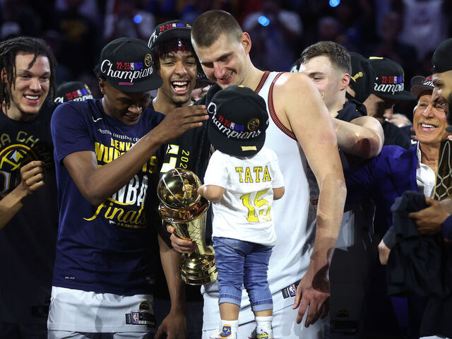 DENVER, COLORADO - JUNE 12: Nikola Jokic #15 of the Denver Nuggets celebrates with the Bill Russell NBA Finals Most Valuable Player Award after a 94-89 victory against the Miami Heat in Game Five of the 2023 NBA Finals to win the NBA Championship at Ball Arena on June 12, 2023 in Denver, Colorado.