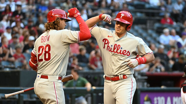 PHOENIX, ARIZONA - JUNE 12: JT Realmuto #10 of the Philadelphia Phillies celebrates with Alec Bohm #28 after hitting a solo home run against the Arizona Diamondbacks during the second inning at Chase Field on June 12, 2023 in Phoenix, Arizona.