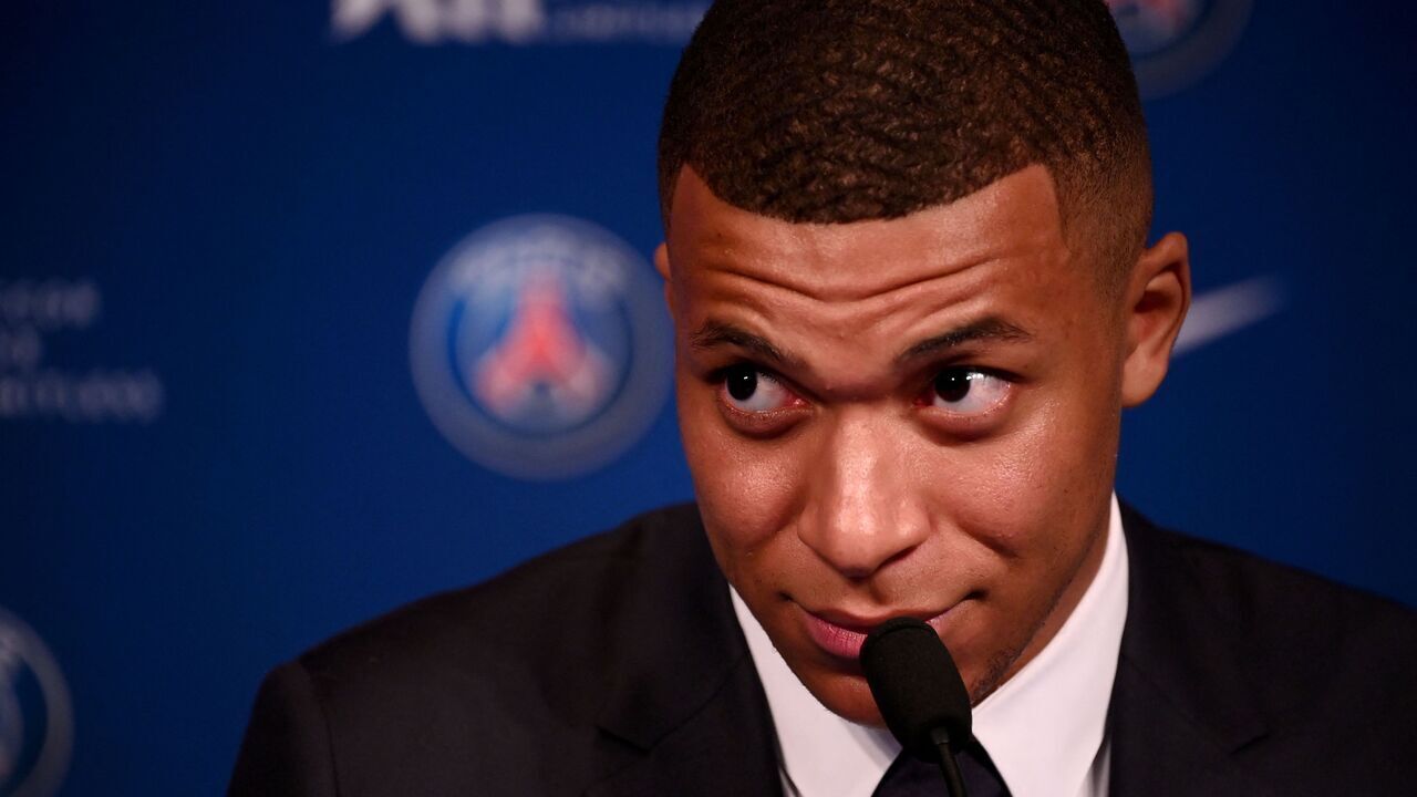 Paris Saint-Germain's French forward Kylian Mbappe attends a press conference at the Parc des Princes stadium in Paris on May 23, 2022, two days after the club won the Ligue 1 title for a record-equalling tenth time and its superstar striker Mbappe chose to sign a new contract until 2025 at PSG rather than join Real Madrid.