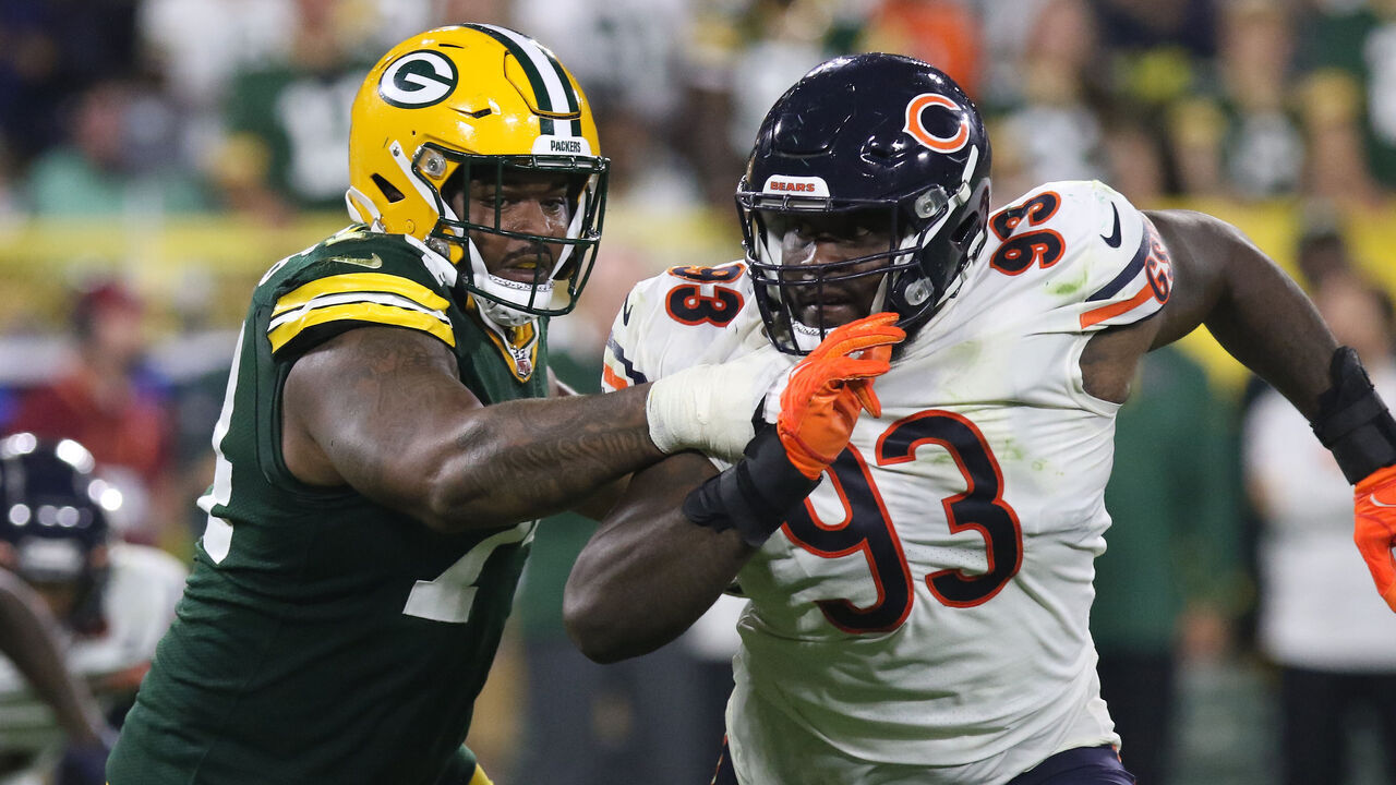 GREEN BAY, WI - SEPTEMBER 18: Green Bay Packers guard Elgton Jenkins (74) blocks Chicago Bears defensive tackle Justin Jones (93) during a game between the Green Bay Packers and the Chicago Bears on September 18, 2022 at Lambeau Field in Green Bay, WI.