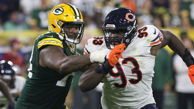 GREEN BAY, WI - SEPTEMBER 18: Green Bay Packers guard Elgton Jenkins (74) blocks Chicago Bears defensive tackle Justin Jones (93) during a game between the Green Bay Packers and the Chicago Bears on September 18, 2022 at Lambeau Field in Green Bay, WI.