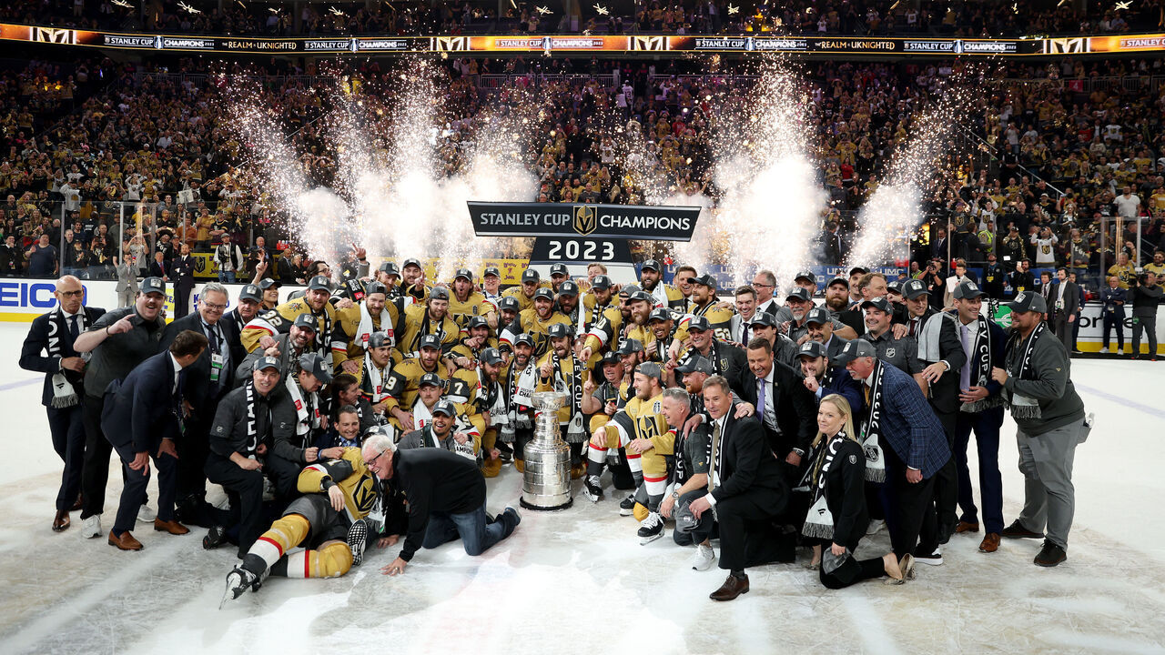 LAS VEGAS, NEVADA - JUNE 13: Members of the Vegas Golden Knights pose with the Stanley Cup after defeating the Florida Panthers to win the championship in Game Five of the 2023 NHL Stanley Cup Final at T-Mobile Arena on June 13, 2023 in Las Vegas, Nevada.