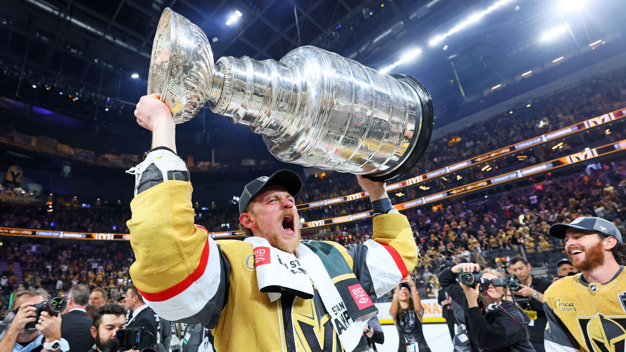 LAS VEGAS, NEVADA - JUNE 13: Jack Eichel #9 of the Vegas Golden Knights hoists the Stanley Cup after defeating the Florida Panthers to win the championship in Game Five of the 2023 NHL Stanley Cup Final at T-Mobile Arena on June 13, 2023 in Las Vegas, Nevada.