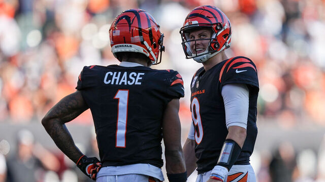 CINCINNATI, OHIO - OCTOBER 23: Ja'Marr Chase #1 and Joe Burrow #9 of the Cincinnati Bengals meet in the fourth quarter against the Atlanta Falcons at Paycor Stadium on October 23, 2022 in Cincinnati, Ohio.