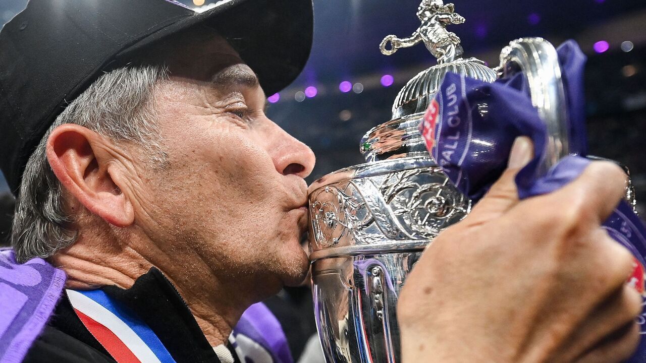 Toulouse's French head coach Philippe Montanier kisses the trophy after winning the French Cup final football match between Nantes (FC) and Toulouse (FC) at the Stade de France, in Saint-Denis, on the outskirts of Paris, on April 29, 2023.