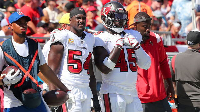 TAMPA, FL - OCTOBER 09: Tampa Bay Buccaneers Linebacker Lavonte David (54) and Linebacker Devin White (45) watch the action on the field during the regular season game between the Atlanta Falcons and the Tampa Bay Buccaneers on October 09, 2022 at Raymond James Stadium in Tampa, Florida.