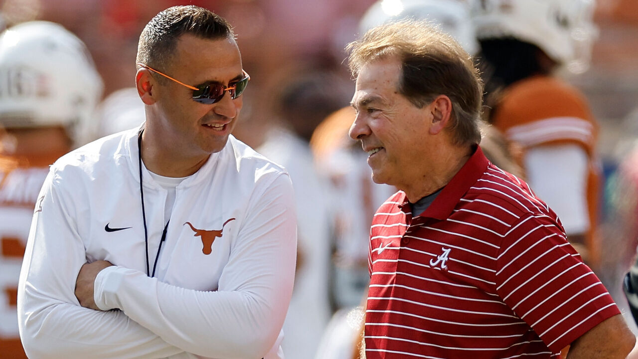 AUSTIN, TEXAS - SEPTEMBER 10: Head coach Steve Sarkisian of the Texas Longhorns talks with head coach Nick Saban of the Alabama Crimson Tide before the game at Darrell K Royal-Texas Memorial Stadium on September 10, 2022 in Austin, Texas.