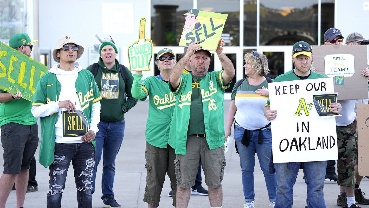 OAKLAND, CALIFORNIA - APRIL 28: With the decision to move from Oakland to Las Vegas fans of the Oakland Athletics protest with signs outside the stadium prior to the start of the game against the Cincinnati Reds at RingCentral Coliseum on April 28, 2023 in Oakland, California.