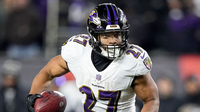 CINCINNATI, OHIO - JANUARY 15: J.K. Dobbins #27 of the Baltimore Ravens carries the ball against the Cincinnati Bengals during the second half in the AFC Wild Card playoff game at Paycor Stadium on January 15, 2023 in Cincinnati, Ohio.