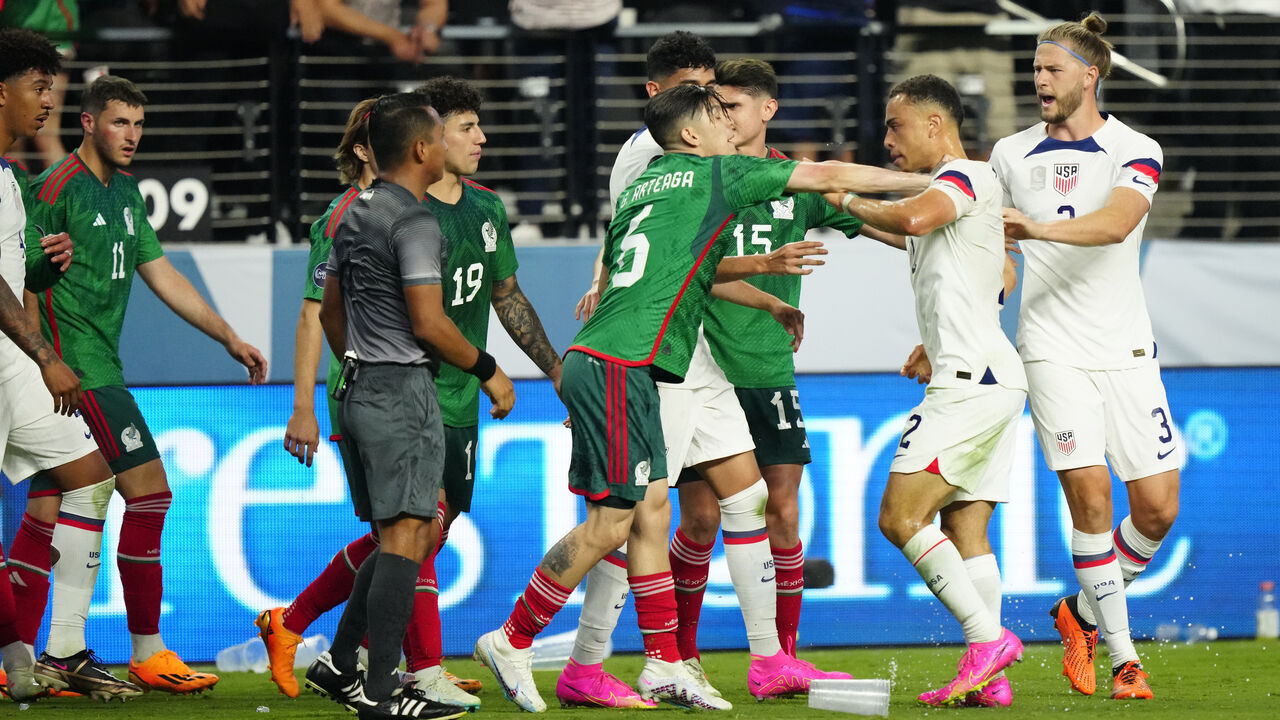 LAS VEGAS, NEVADA - JUNE 15: Sergino Dest #2 of USA and Gerardo Arteaga #6 of Mexico scuffle as teammates break it up in the second half during the 2023 CONCACAF Nations League semifinals at Allegiant Stadium on June 15, 2023 in Las Vegas, Nevada.